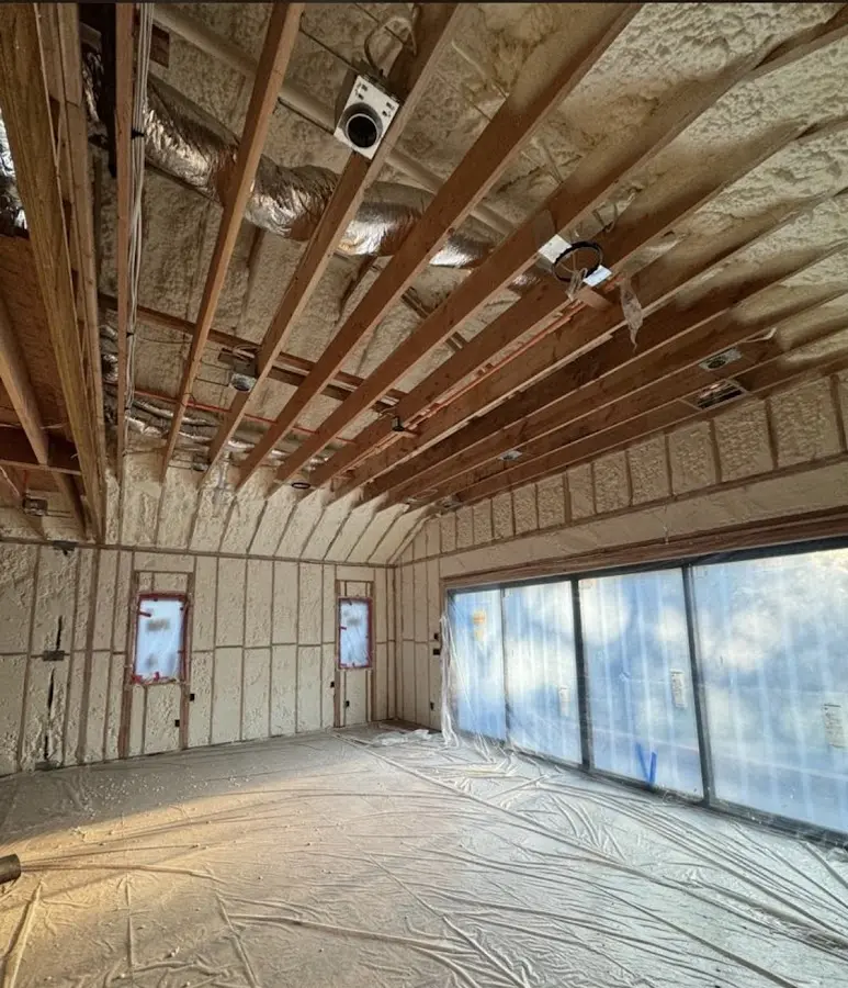 Interior walls and ceiling insulated with spray foam during new construction in Lafayette